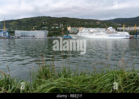 Evening view of white Japanese cruise liner Pacific Venus anchored at marine station in Sea Port of Petropavlovsk-Kamchatsky City Stock Photo