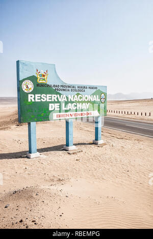 Road sign showing the entrance of Lachay National Reserve at Panamerican Highway. Huacho, Department of Lima, Peru. Stock Photo