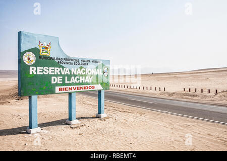 Road sign showing the entrance of Lachay National Reserve at Panamerican Highway. Huacho, Department of Lima, Peru. Stock Photo