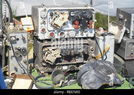 Old radio engineering devices. Scale with arrow, transceiver, measuring instruments Stock Photo