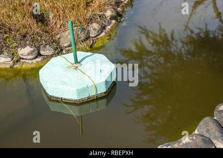 ice preventers, garden pond Stock Photo