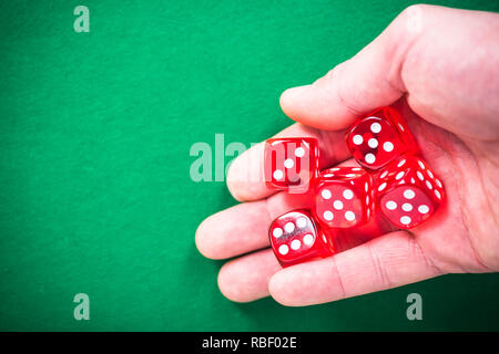 Hand throwing red dices, good luck concept. Stock Photo