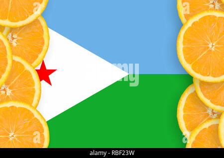 Djibouti flag  in vertical frame of orange citrus fruit slices. Concept of growing as well as import and export of citrus fruits Stock Photo