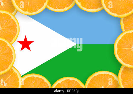 Djibouti flag  in frame of orange citrus fruit slices. Concept of growing as well as import and export of citrus fruits Stock Photo