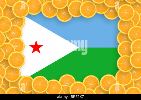 Djibouti flag  in frame of orange citrus fruit slices. Concept of growing as well as import and export of citrus fruits Stock Photo