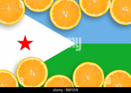 Djibouti flag  in horizontal frame of orange citrus fruit slices. Concept of growing as well as import and export of citrus fruits Stock Photo