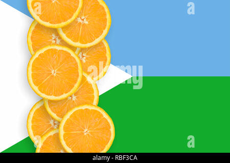 Djibouti flag and vertical row of orange citrus fruit slices. Concept of growing as well as import and export of citrus fruits Stock Photo