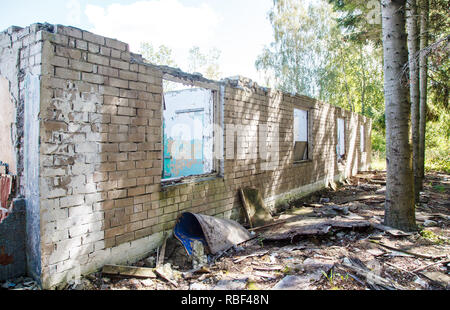 old abandoned ruined house on sunny summer day Stock Photo