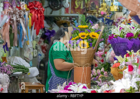 Flower market worker in Bangkok Stock Photo