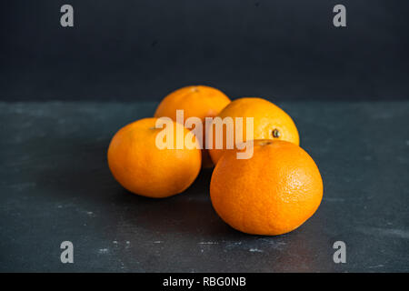 Mandarins on a dark background Stock Photo