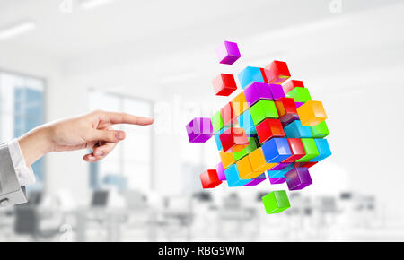 Integrating new technologies concept with cube figure floating in air. Mixed media Stock Photo