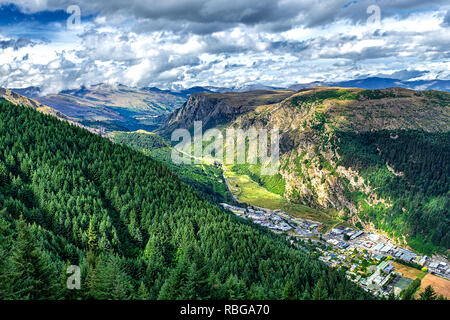 Beautiful valley near Queenston, New Zealand with high mountains and coniferous forest on the slope Stock Photo