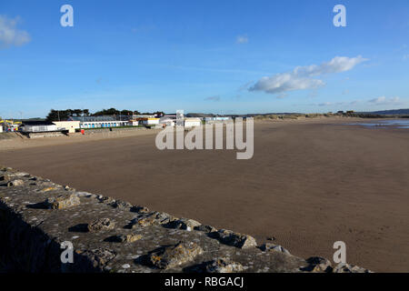 Sand Bay at Porthcawl on a sunny winters day with everyone out for a walk along the promenade beside the seaside in this popular seaside town. Stock Photo
