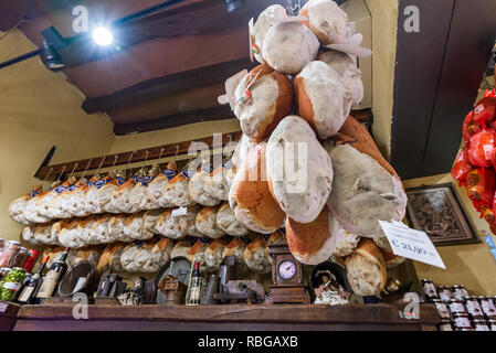 Bologna, Italy - June 2017: Local shop with traditional prosciutto and salami in Bologna. Emilia Romagna. Stock Photo
