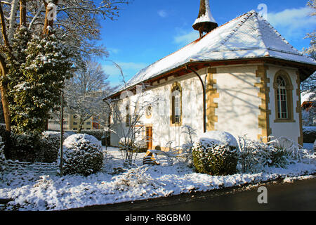 Gothic protestant church in Lyss, Switzerland. Winter scene. Stock Photo