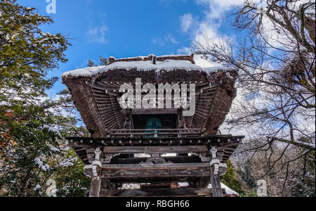 Bell Tower of ancient temple in Historic Village of Shirakawago at winter in Gifu, Japan. Stock Photo
