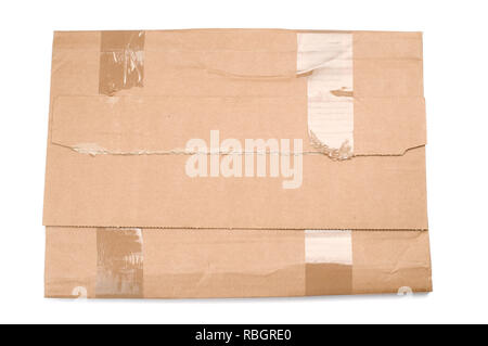 Taped cardboard book mailer on white background. Stock Photo