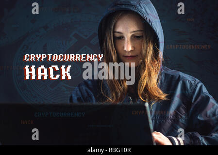 A girl hacker with a face is trying to steal cryptocurrency using a computer. Fraud and scam at Cryptojacking Stock Photo