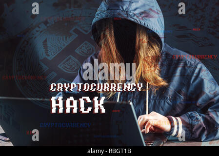 A girl hacker without a face is trying to steal cryptocurrency using a computer. Fraud and scam at Cryptojacking Stock Photo
