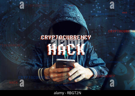 An anonymous hacker without a face is trying to steal cryptocurrency using a computer. Fraud and deception at Cryptojacking Stock Photo