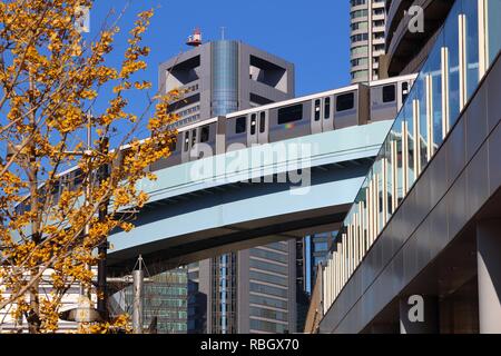 TOKYO, JAPAN - DECEMBER 2, 2016: Monorail train in Shiodome district in Tokyo. New Transit Yurikamome monorail is an automated guideway transit servic Stock Photo
