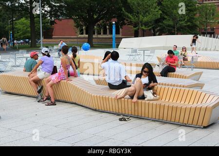 CAMBRIDGE, USA - JUNE 9, 2013: People visit Harvard University campus in Cambridge, MA. Harvard was established in 1636. Its annual endowment is 36.4  Stock Photo