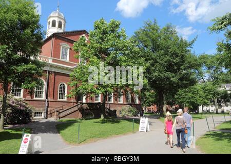 CAMBRIDGE, USA - JUNE 9, 2013: People visit Harvard University campus in Cambridge, MA. Harvard was established in 1636. Its annual endowment is 36.4  Stock Photo