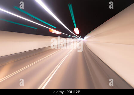 Riding speed bus blurred background in tunnel in hong kong Stock Photo