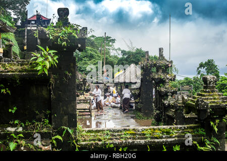 Bali, Indonesia - 08 March 2018: People preparing to celebrate in balinese temple. Pura Penataran Agung Lempuyang and Balinese Hindu ethnic people Stock Photo