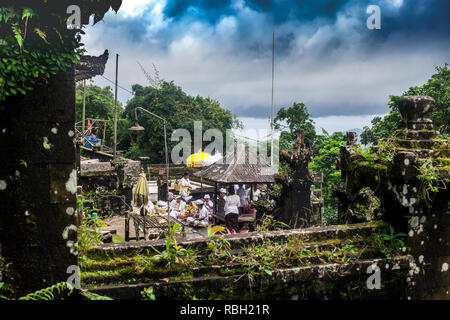 Bali, Indonesia - 08 March 2018: People preparing to celebrate in balinese temple. Pura Penataran Agung Lempuyang and Balinese Hindu ethnic people Stock Photo