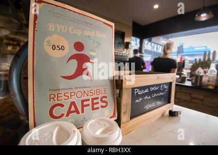 A sign in a northern Sydney cafe offering discounts for bring your own (BYO) cup coffee drinkers. Responsible Cafes reducing waste and pollution. Stock Photo