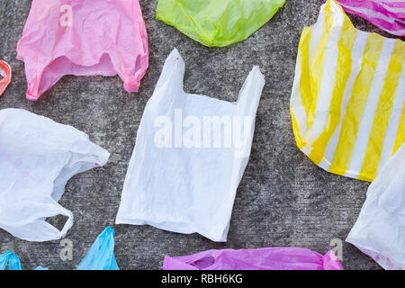 Plastic bags on cement floor background. Stock Photo