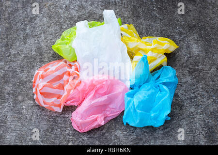 Plastic bags on cement floor background. Stock Photo