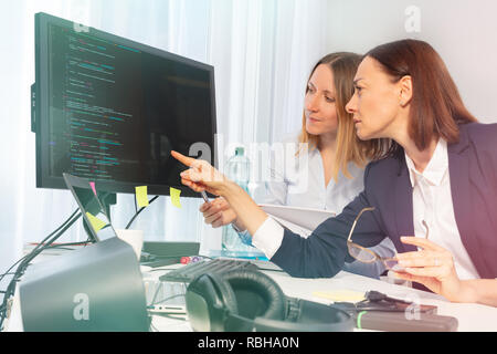Business women working on computer in the office Stock Photo
