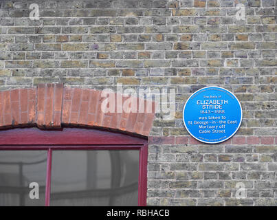 Blue plaque (about Elizabeth Stride, a Jack the Ripper victim) on the wall of Jack the Ripper museum, Cable Street, Whitechapel, London, England. Stock Photo