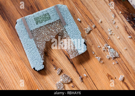 Broken digital human scale on the floor. Broken glassy digital scale for measuring people Stock Photo