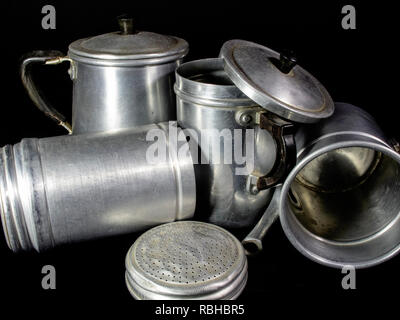 old aluminum cans, used as containers or for cooking Stock Photo