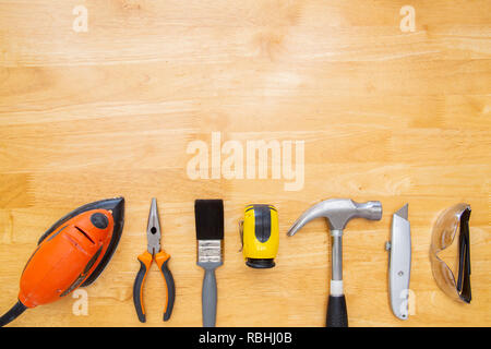 Various household tools sit on a kitchen table top, with space for copy. Stock Photo