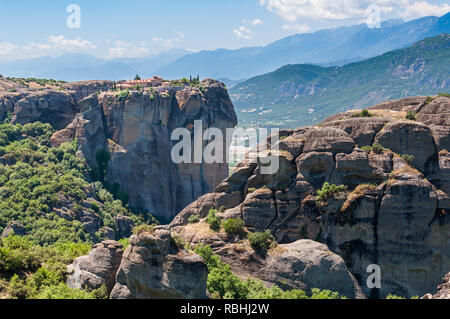 The Holy Trinity Monastery in Meteora, Greece and it surrounding landscape with mountains in the background. Stock Photo