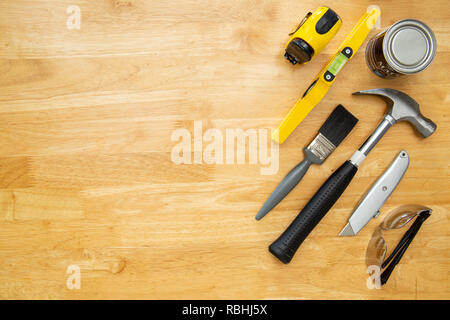 Various household tools sit on a kitchen table top, with space for copy. Stock Photo