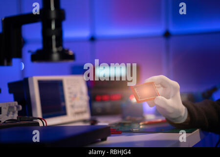 Check electronics device in industrial lab Stock Photo