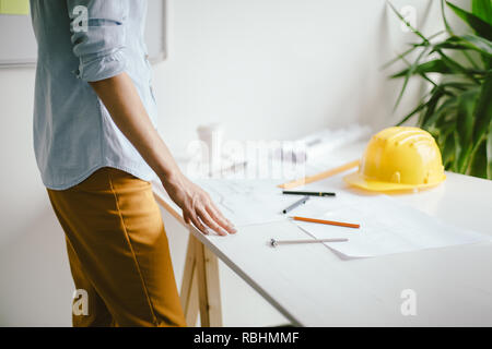 Construction engineering. Close up of engineers hands working on table Stock Photo