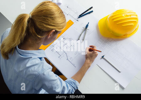 Close up of architect working on the construction project. Construction engineer working on project Stock Photo