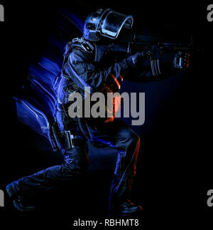 one soldier police swat tactical forces man studio shot  isolated on black background Stock Photo