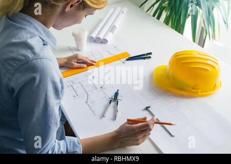 Close up of architect working on the construction project. Construction engineer working on project Stock Photo