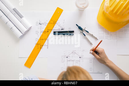 Architect drawing blueprints. Architectural/engineering project concept Stock Photo