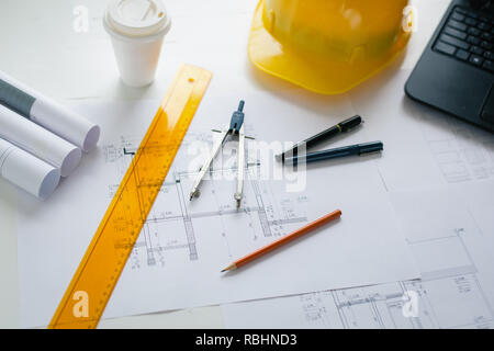 Engineers equipment and blueprints on the office desk. Construction engineer equipment Stock Photo