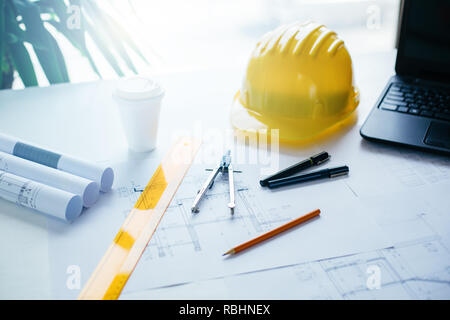 Engineers equipment and blueprints on the office desk. Construction engineer equipment Stock Photo