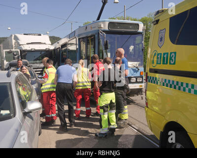 Traffic accident, truck getting into the path of a heavy tram, emergency services on the job, Oslo Norway Stock Photo