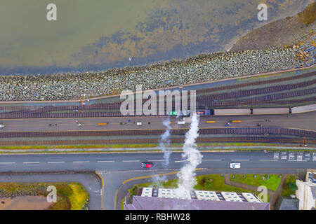 Aerial view of a vintage steam engine train with puffing smoke Stock Photo